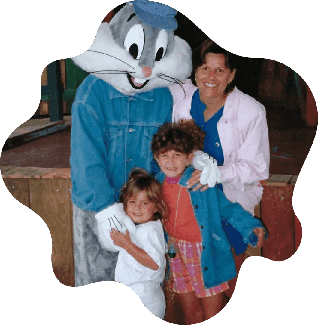 Two children with an adult and a Bugs Bunny mascot.